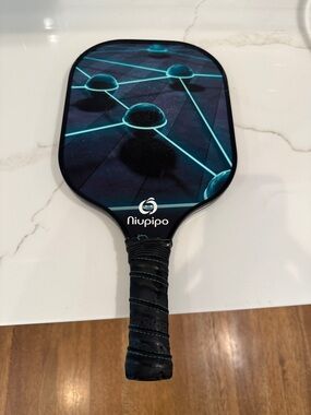 Niupipo Graphic Paddle with Teal Network Design
